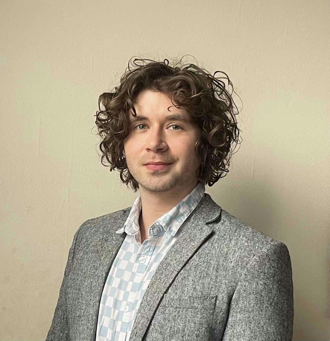 Professional headshot of a male CEO in a suit